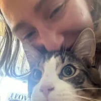 Dawn of High Park Pet Care with a cat